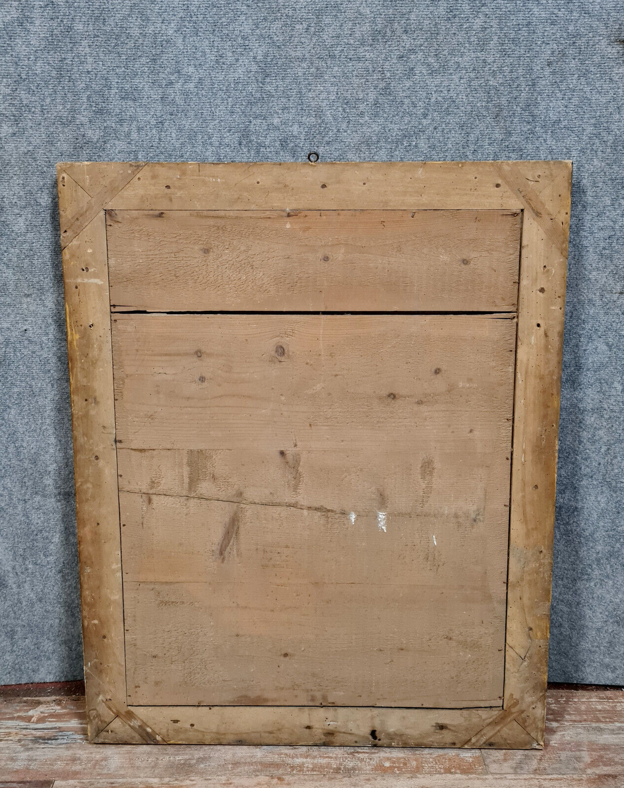 Old nineteenth century mirror in gilded wood and carved around 1850