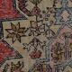 Vintage Turkish rug in beige and red with oriental design, 135 × 210 cm