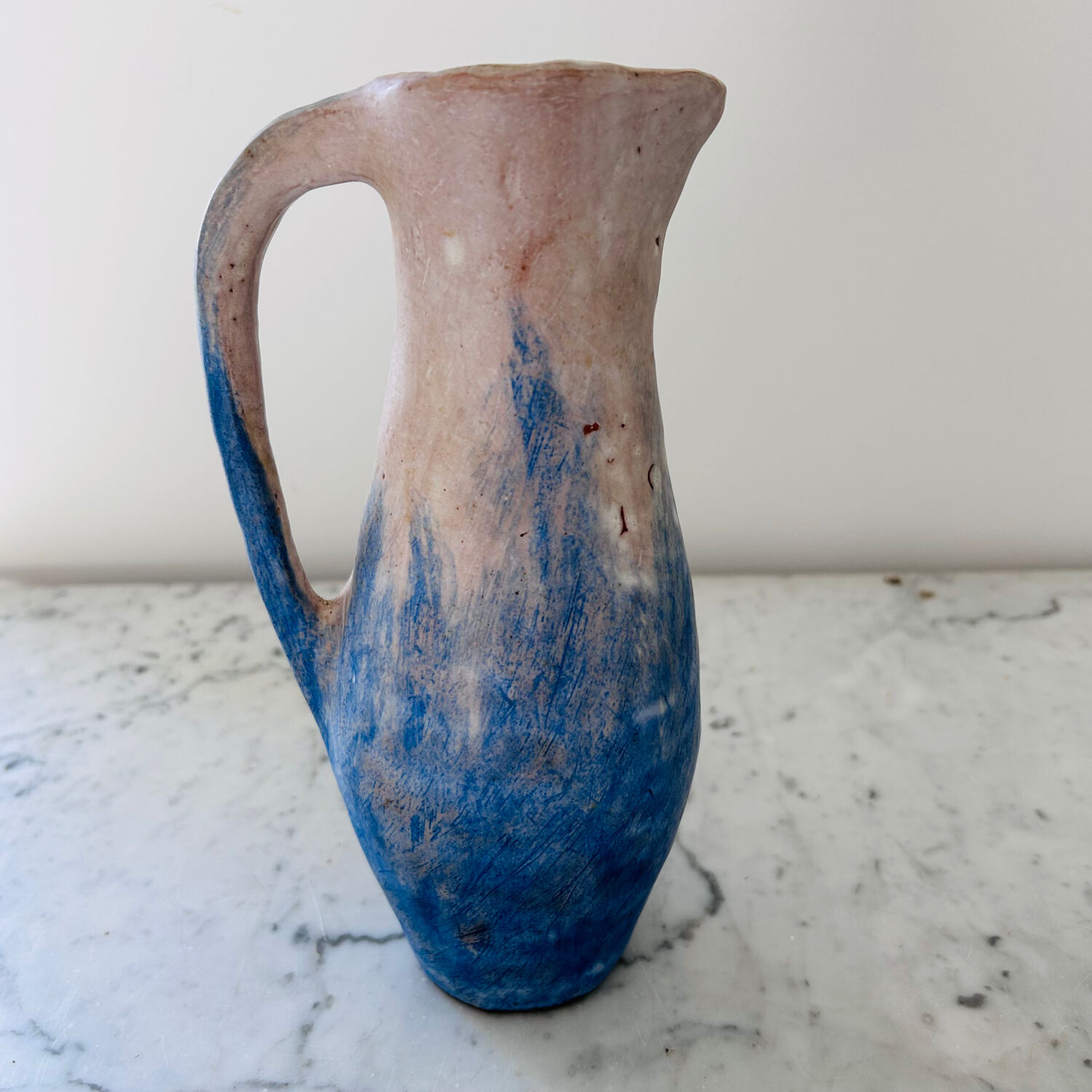 Set of artisanal pitcher and weathered cups