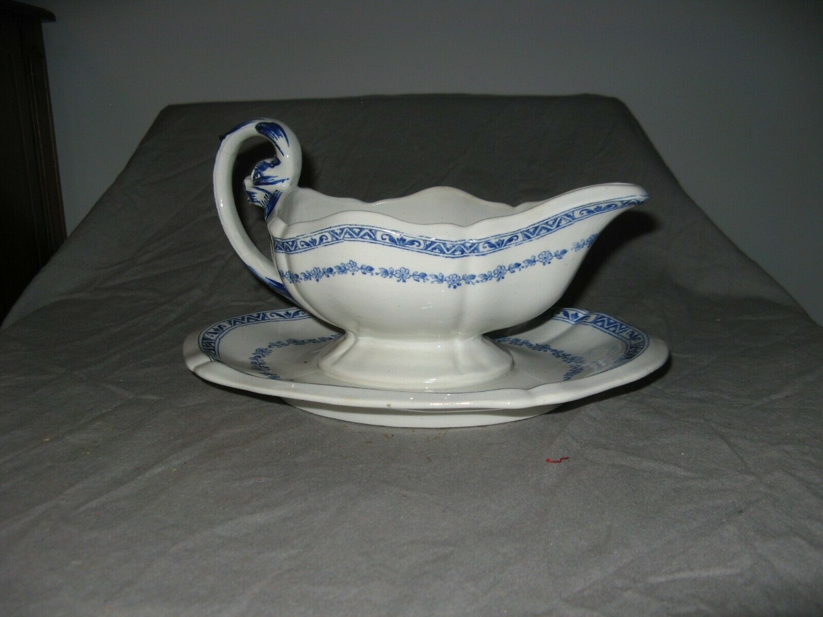 Saucière in Gien earthenware anse in the shape of a dolphin decoration garland 1900