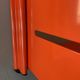 Modular red metal wall shelf in Congresso Lips Vago style.