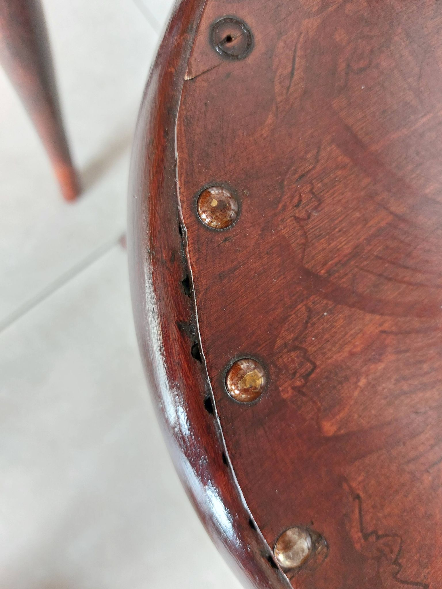 pair of round bistro chairs with a pattern on the seat, vintage