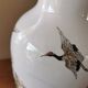 Vintage ceramic vase with Asian decor.