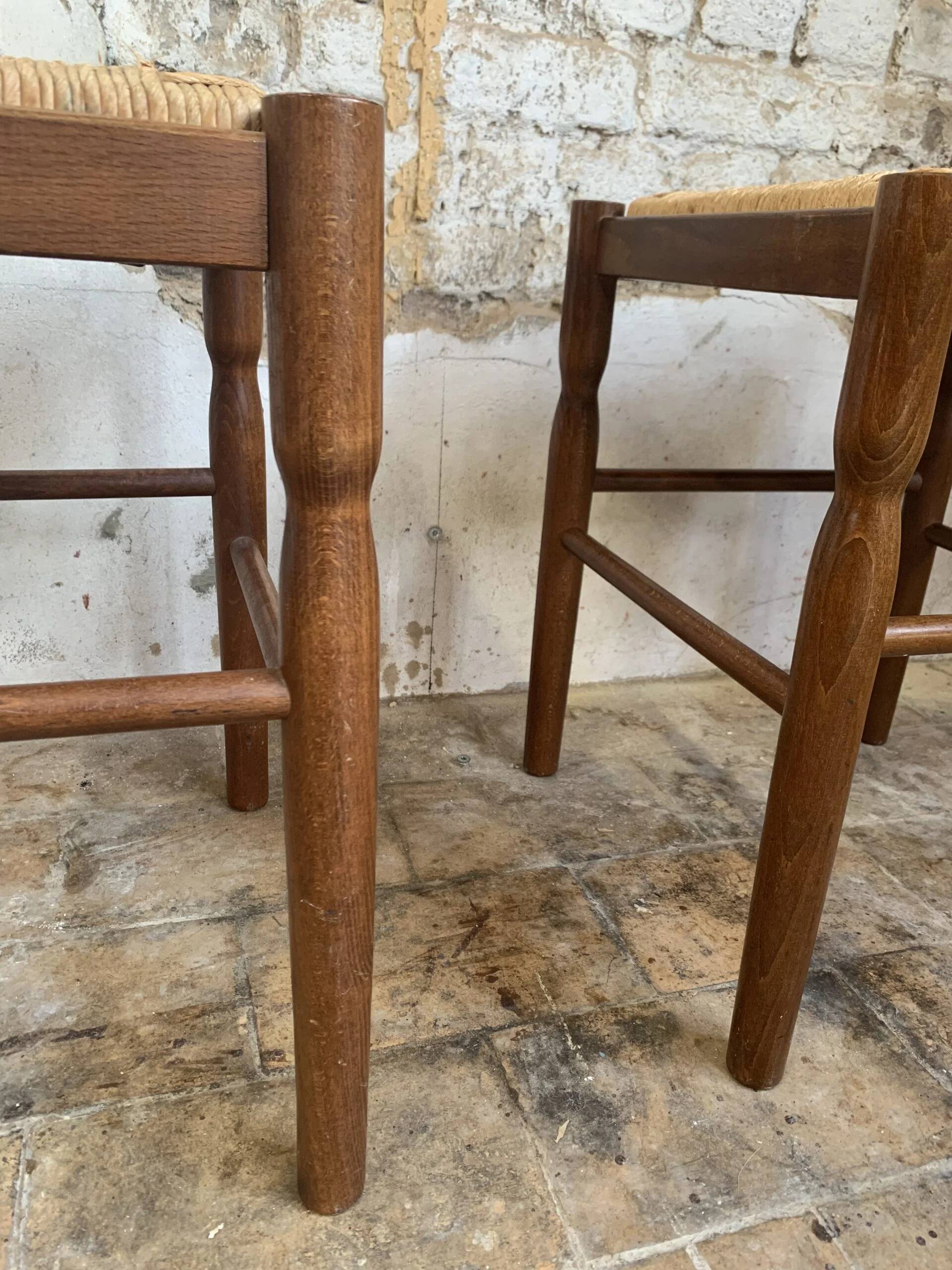 Pair of 20th-century wooden stools with straw seats