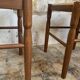 Pair of 20th-century wooden stools with straw seats