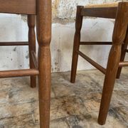 Pair of 20th-century wooden stools with straw seats