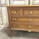Commode Louis XVI en merisier clair vers 1970