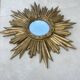 Large sun mirror in carved gilded wood.