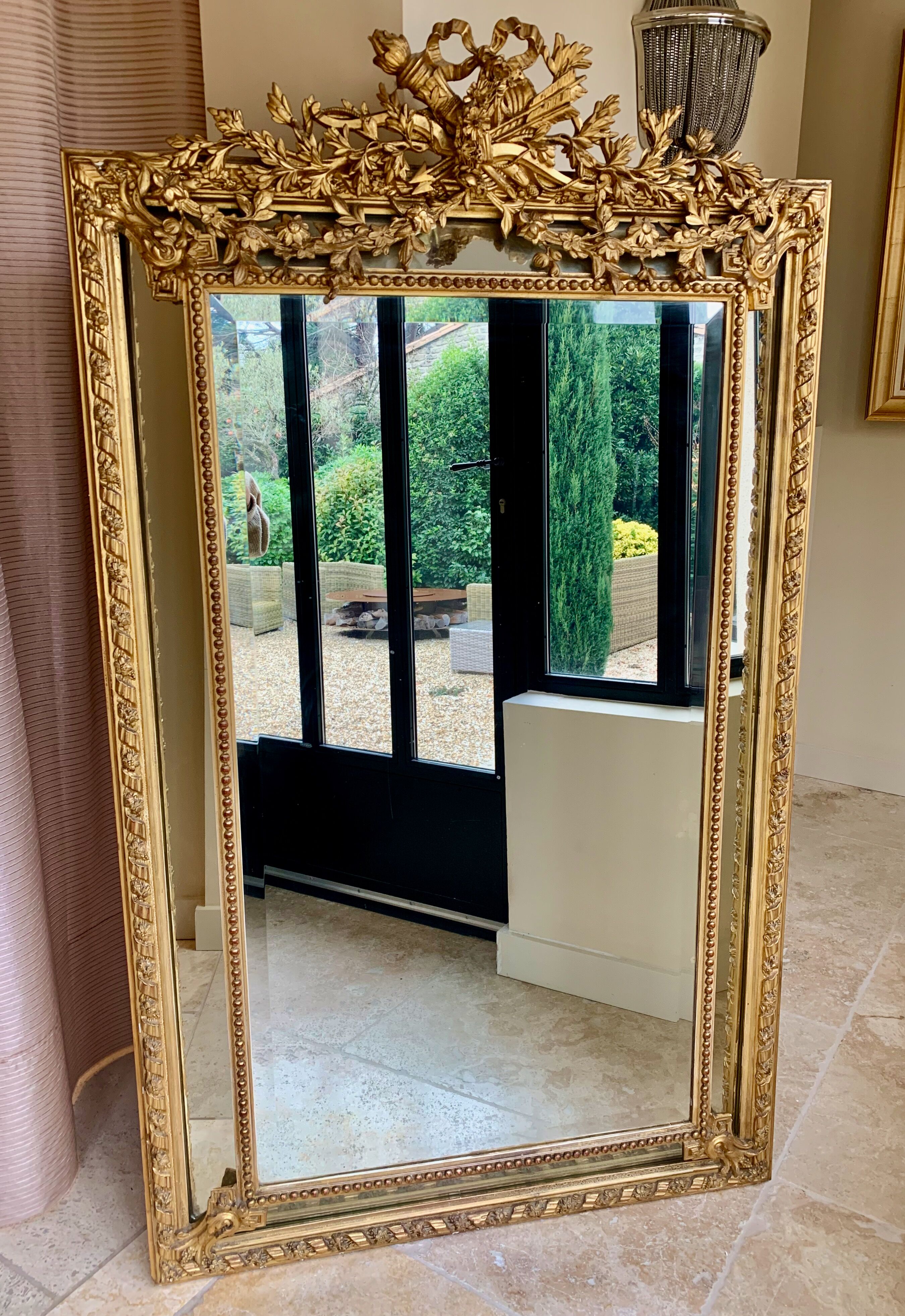 Large mirror style Louis XVI in gilded wood with parecloses xixth h: 165 cm