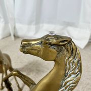 Hollywood Regency style coffee table, 6 patinated brass horses and glass top, 1970.