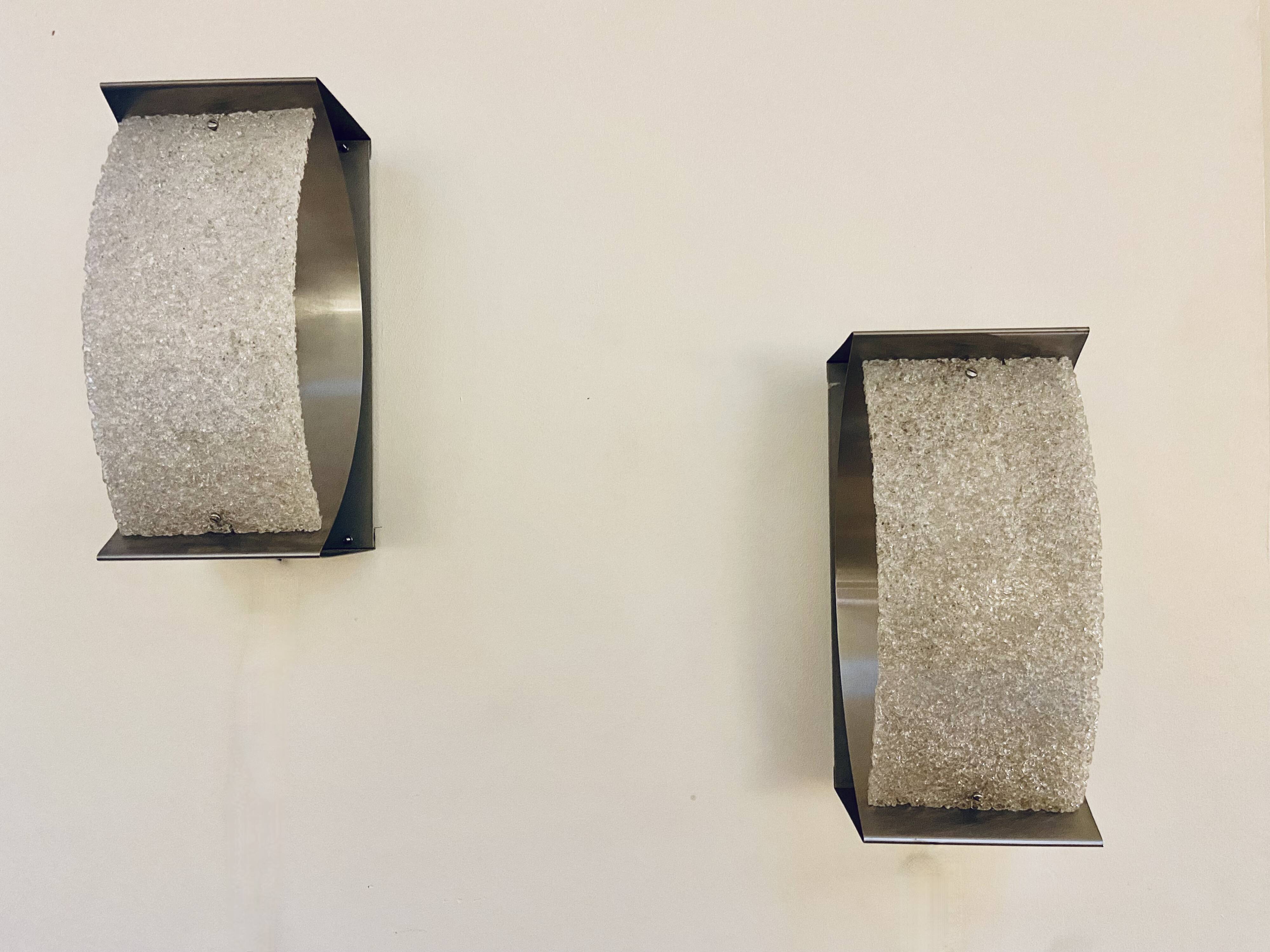 Pair of brushed steel and perspex wall lights, circa 1970.