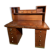 Vintage desk with drawers and a hutch with numerous drawers.