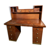 Vintage desk with drawers and a hutch with numerous drawers.