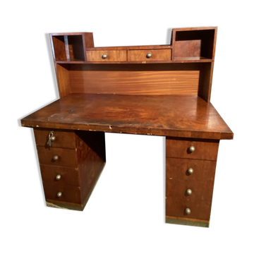 Vintage desk with drawers and a hutch with numerous drawers.