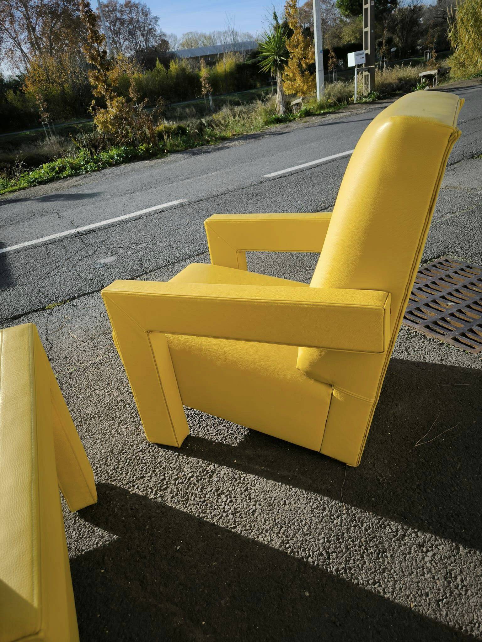 Pair of armchairs in sunny yellow leather