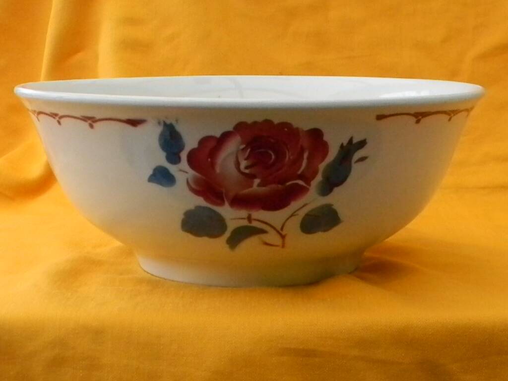 Vintage earthenware salad bowl. Flower decor.