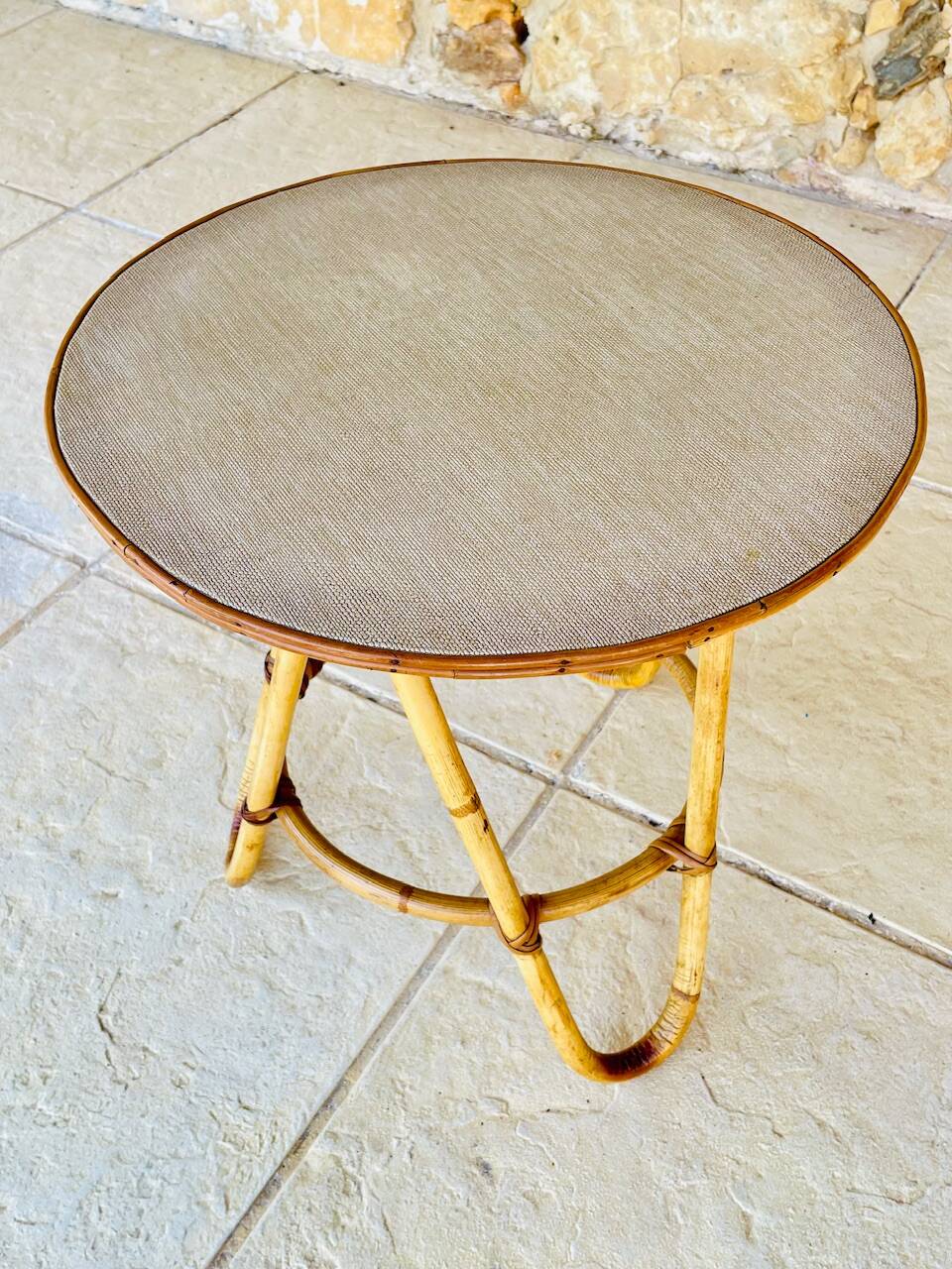 Vintage rattan and bamboo side table, circa 1969.