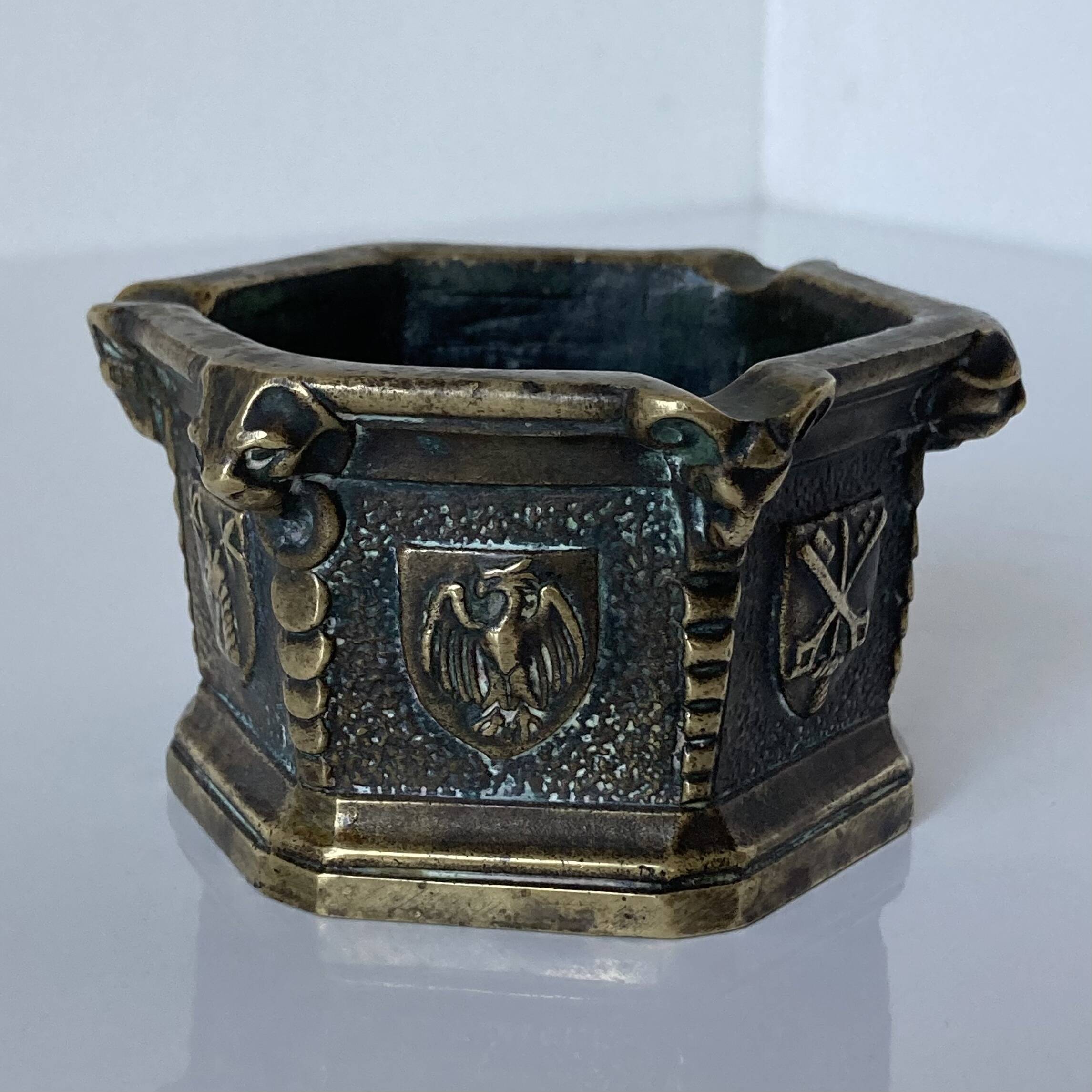 Gothic style bronze ashtray in the shape of a well with heraldic motifs by Max Le Verrier