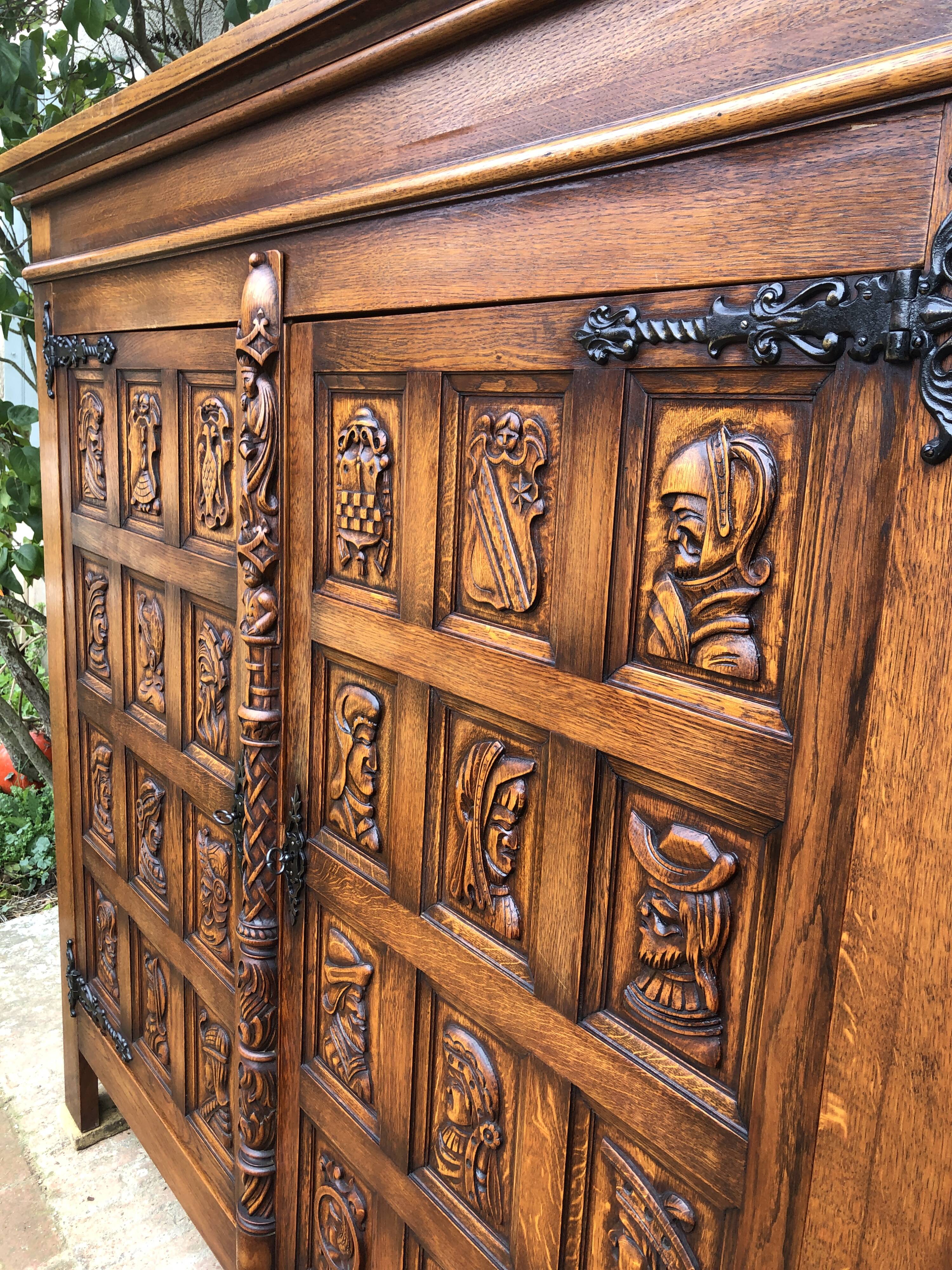 Spanish furniture with carved wood profiles and coats of arms from the 1950s.