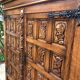 Spanish furniture with carved wood profiles and coats of arms from the 1950s.