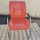 Orange leather cantilever tubular armchair