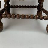 Brutalist wood turned bobbin low rush chair in the style of Charles Dudouyt