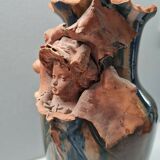 Terracotta vase with a child's head