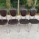 Set of 4 vintage chairs from the 60s/70s in brown faux leather with chrome compass legs.