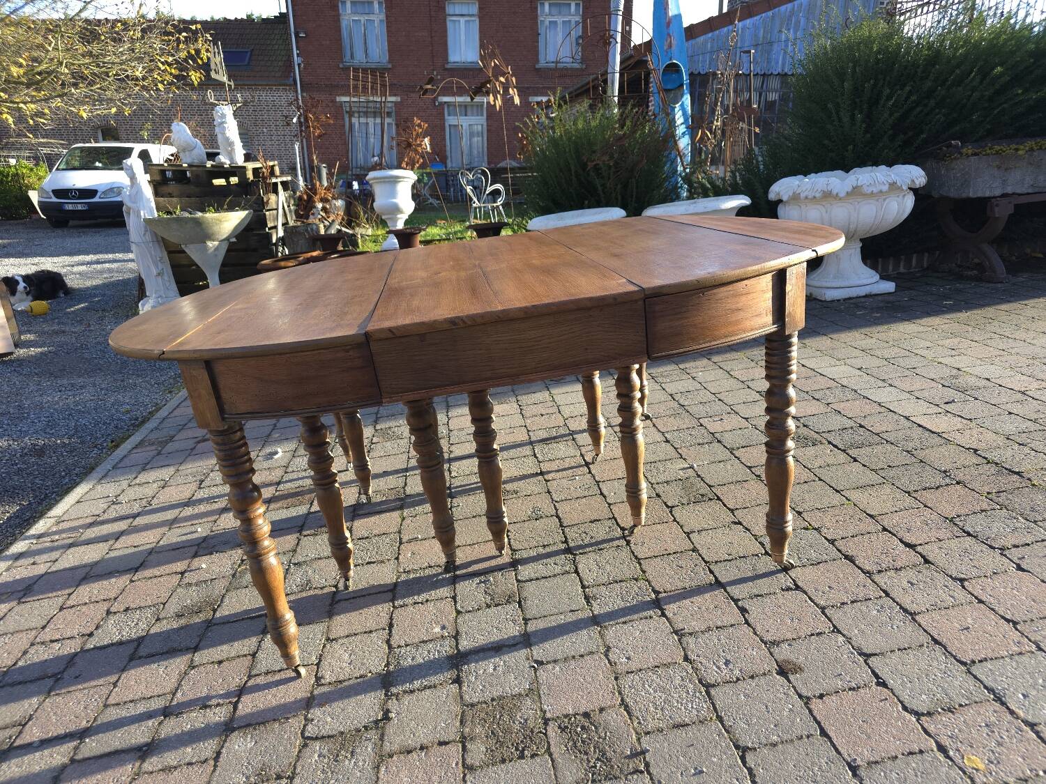 12-foot round oak table with 7 extensions / 20 people