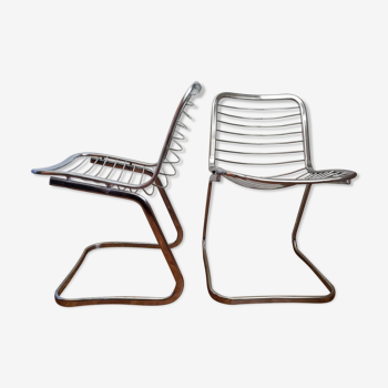 2 chrome wired chairs