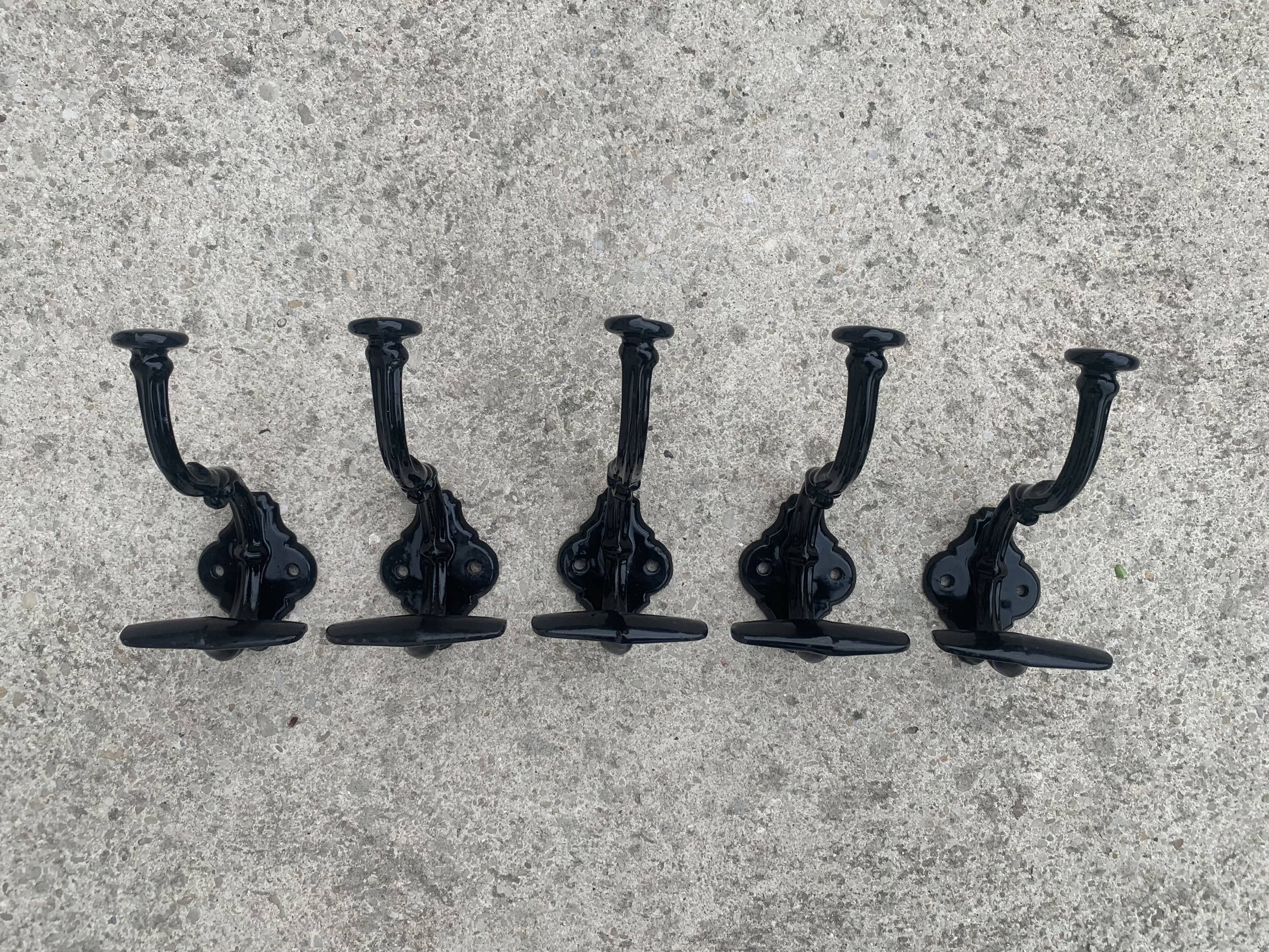 Set of 5 old cast iron hooks