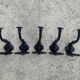 Set of 5 old cast iron hooks