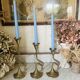 Art Nouveau style brass candlestick trio