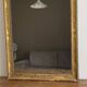 Golden mirror from the late 19th century with decoration. 100x80.