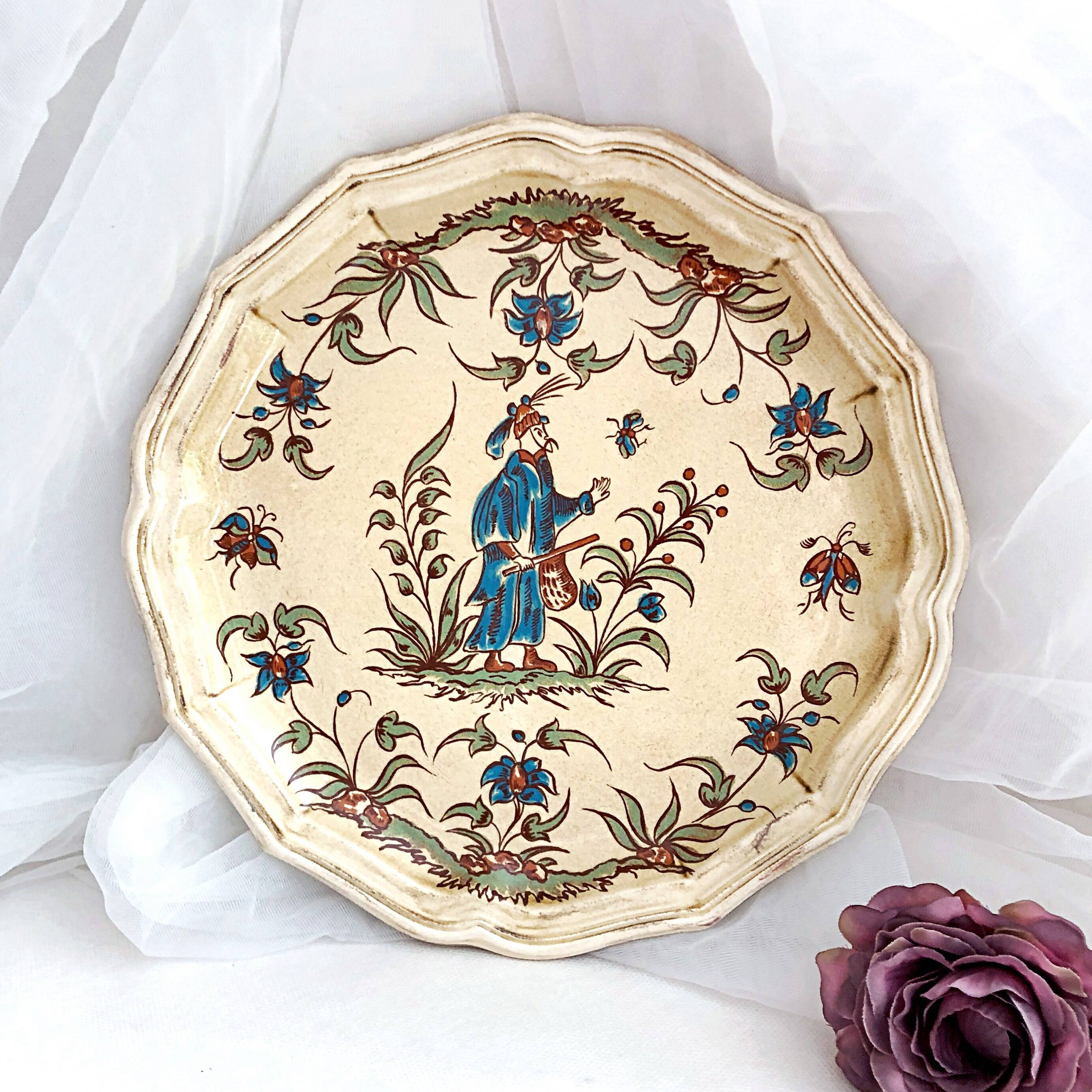 Decorative earthenware plate from Salins France, Moustiers decor, 25.5 cm