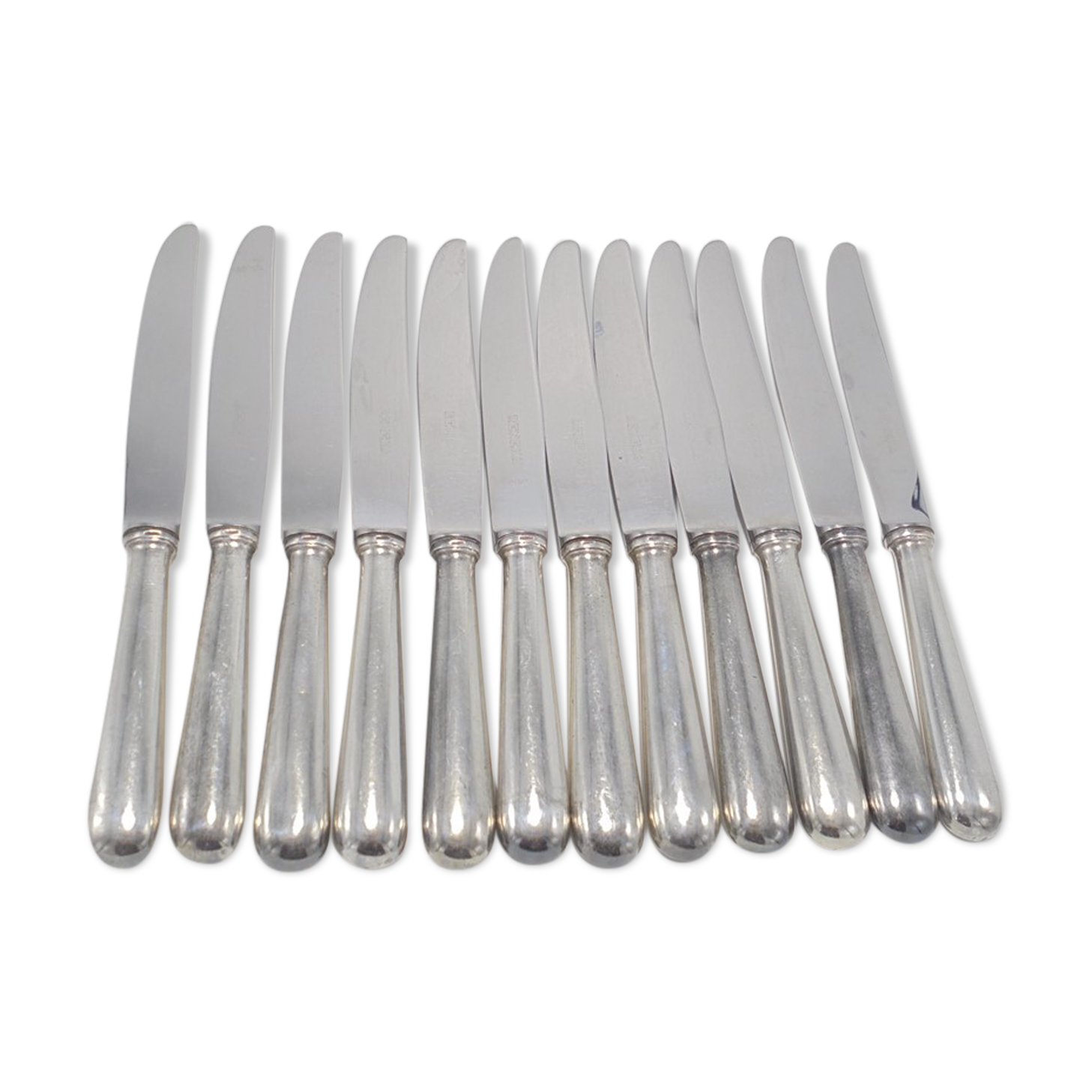 Series of 12 silver knives