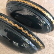 Set of two vintage wall sconces in pine green and gold.