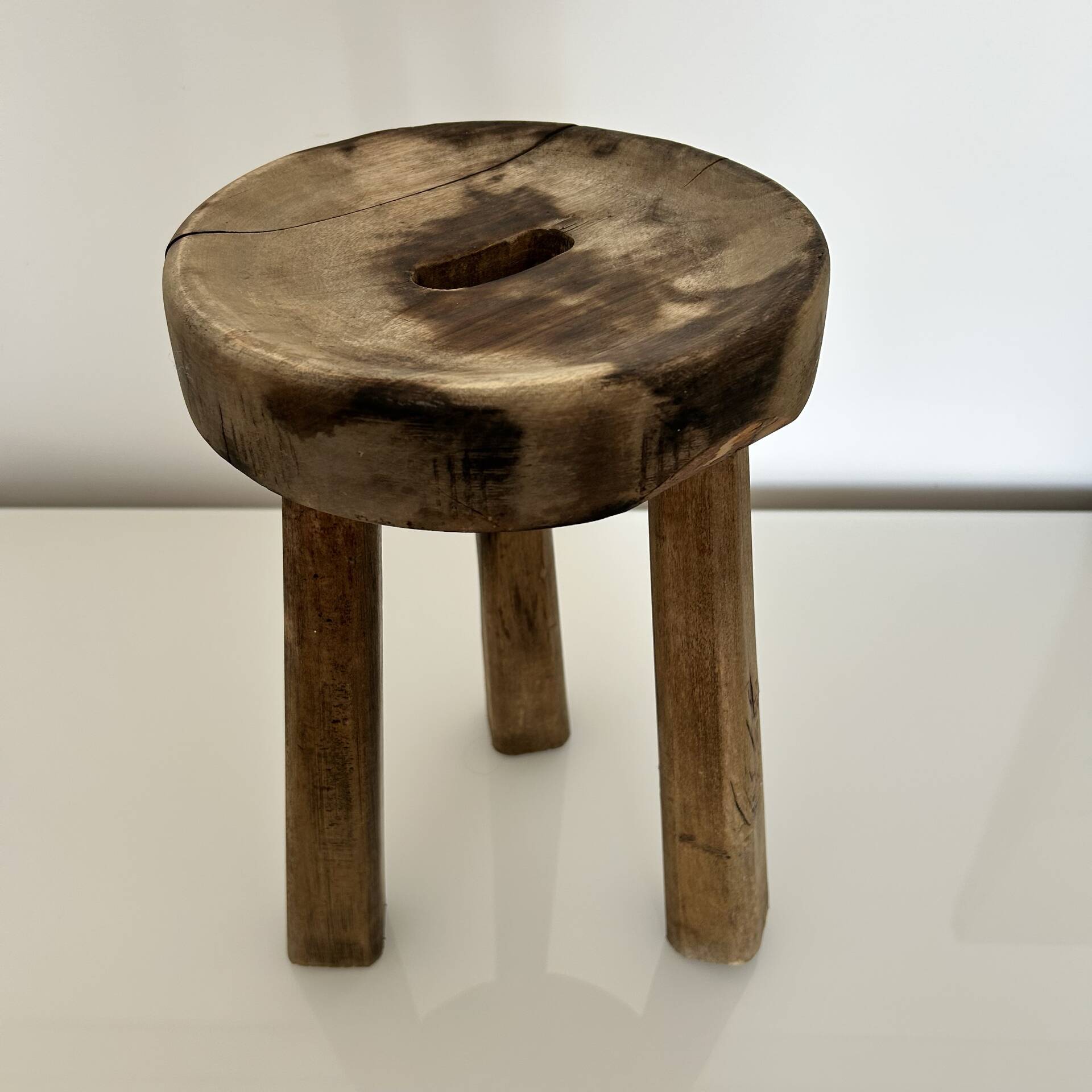 Patinated tripod stool