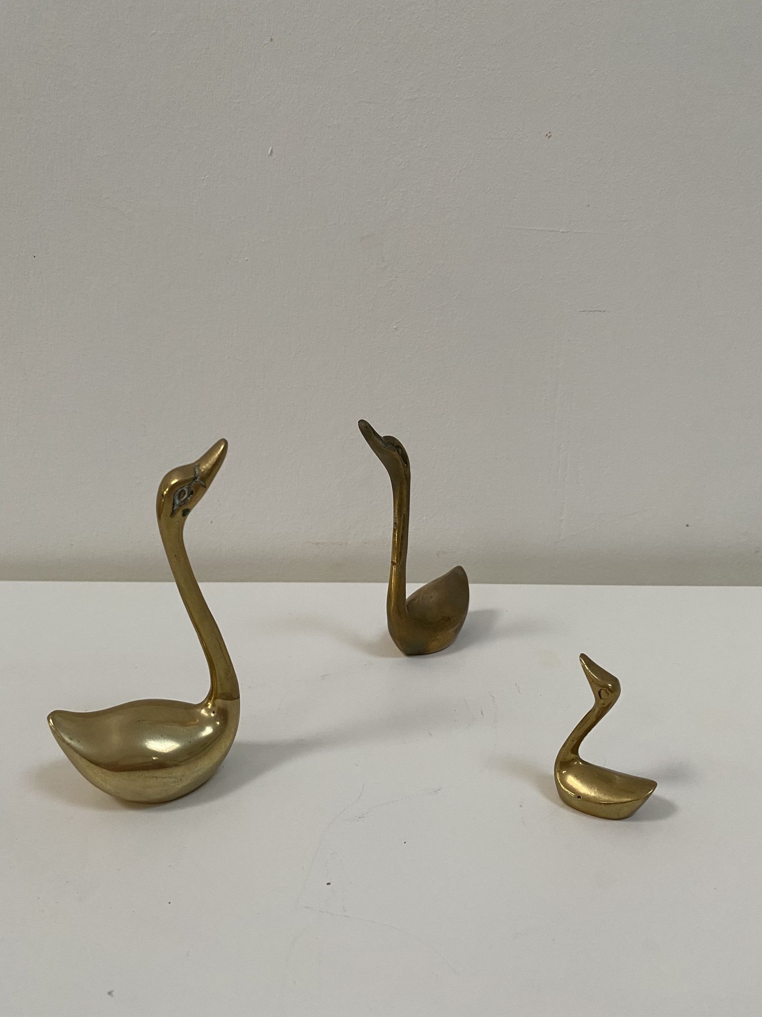 Family of brass swans of the 70s