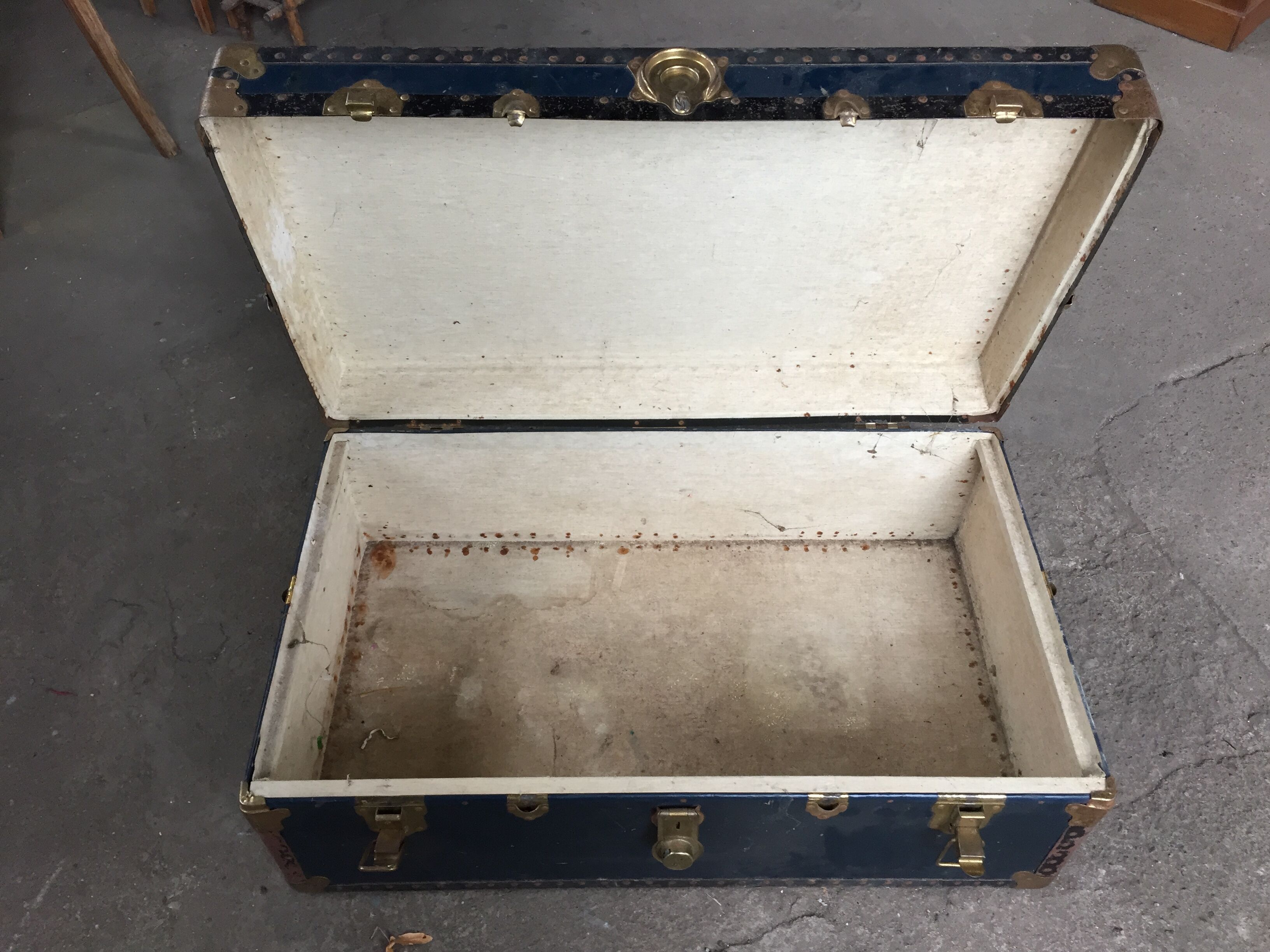 Large blue travel trunk