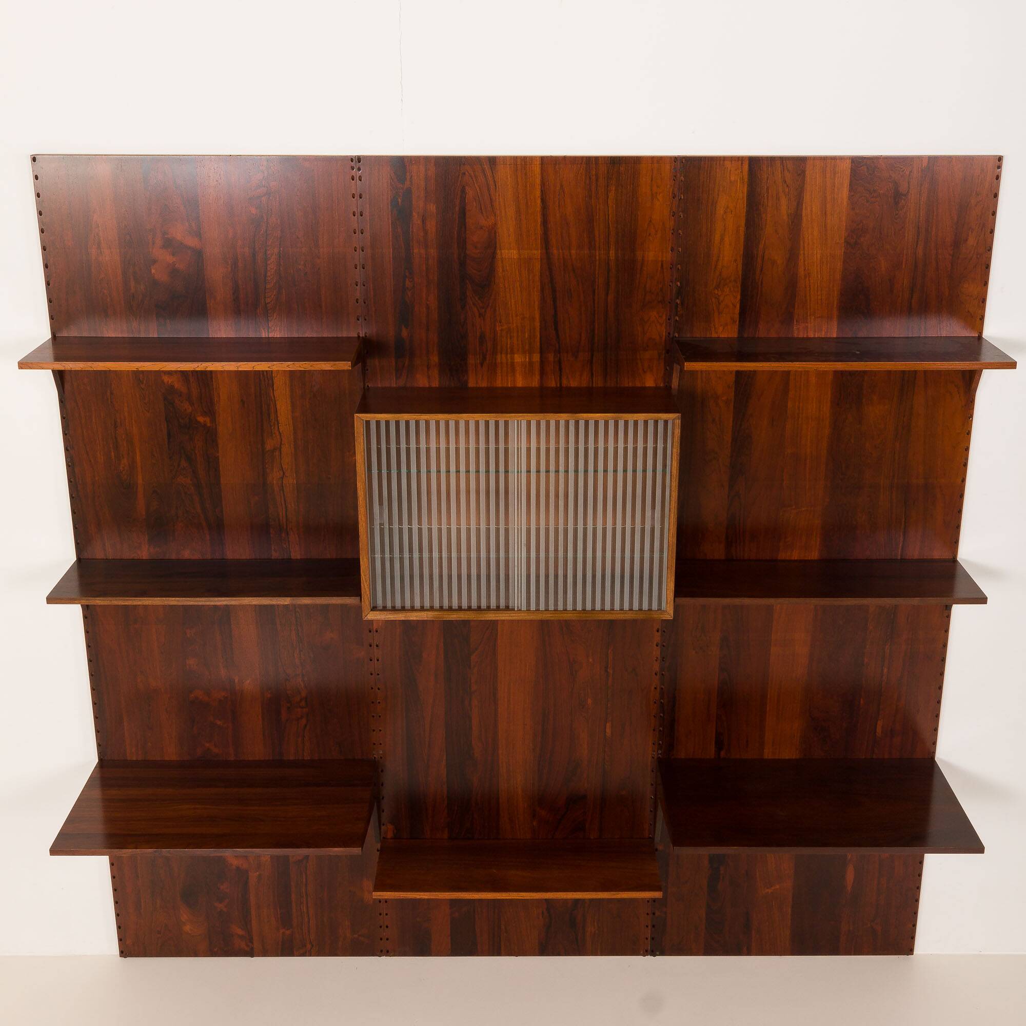 Poul Cadovius rosewood wall unit on panels for Cado, Denmark 1960s