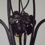 French Art Nouveau leaf detail iron three-light chandelier with amber glass shades.