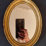 Old golden oval mirror