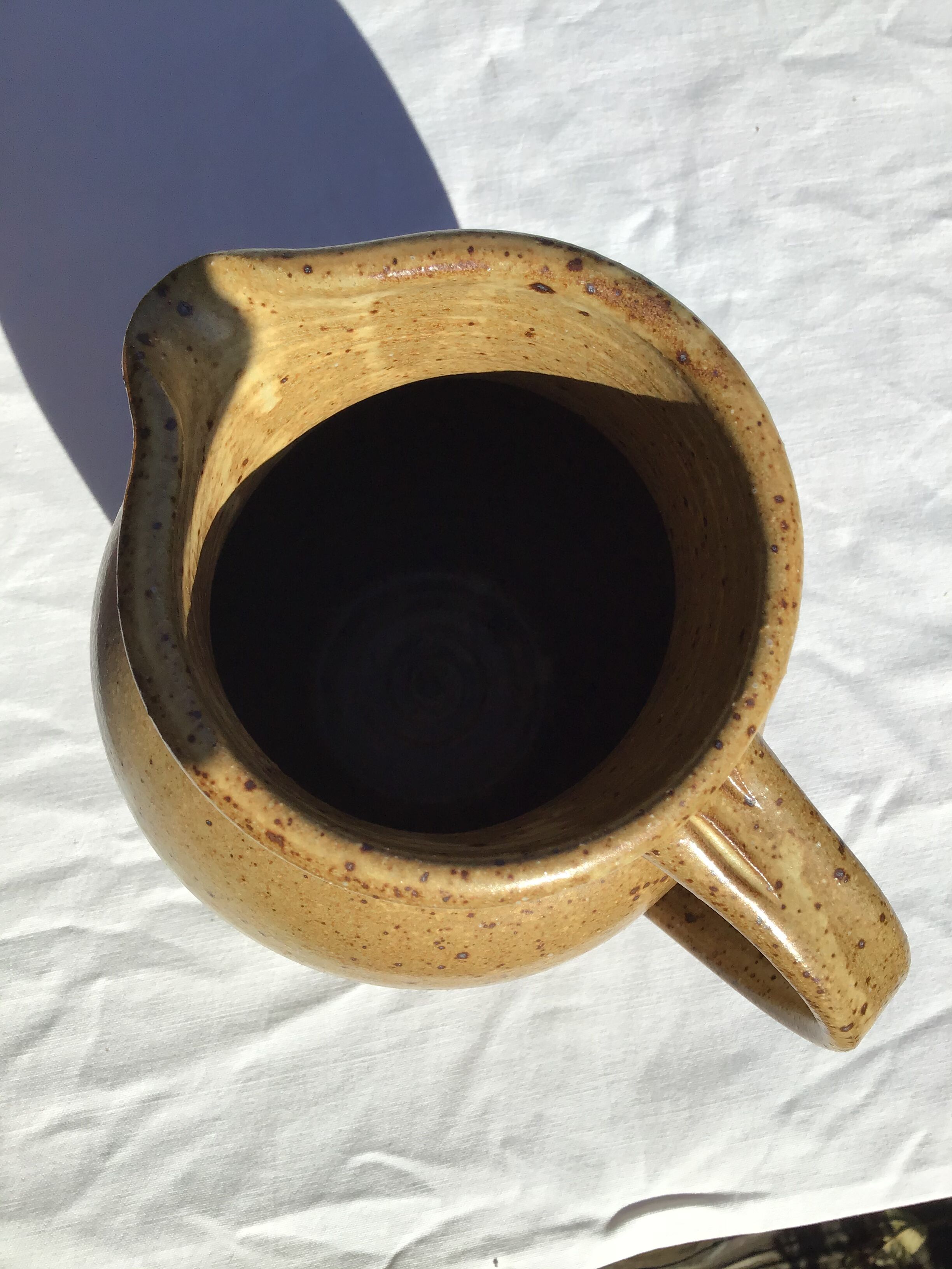 Beige handcrafted speckled sandstone pitcher