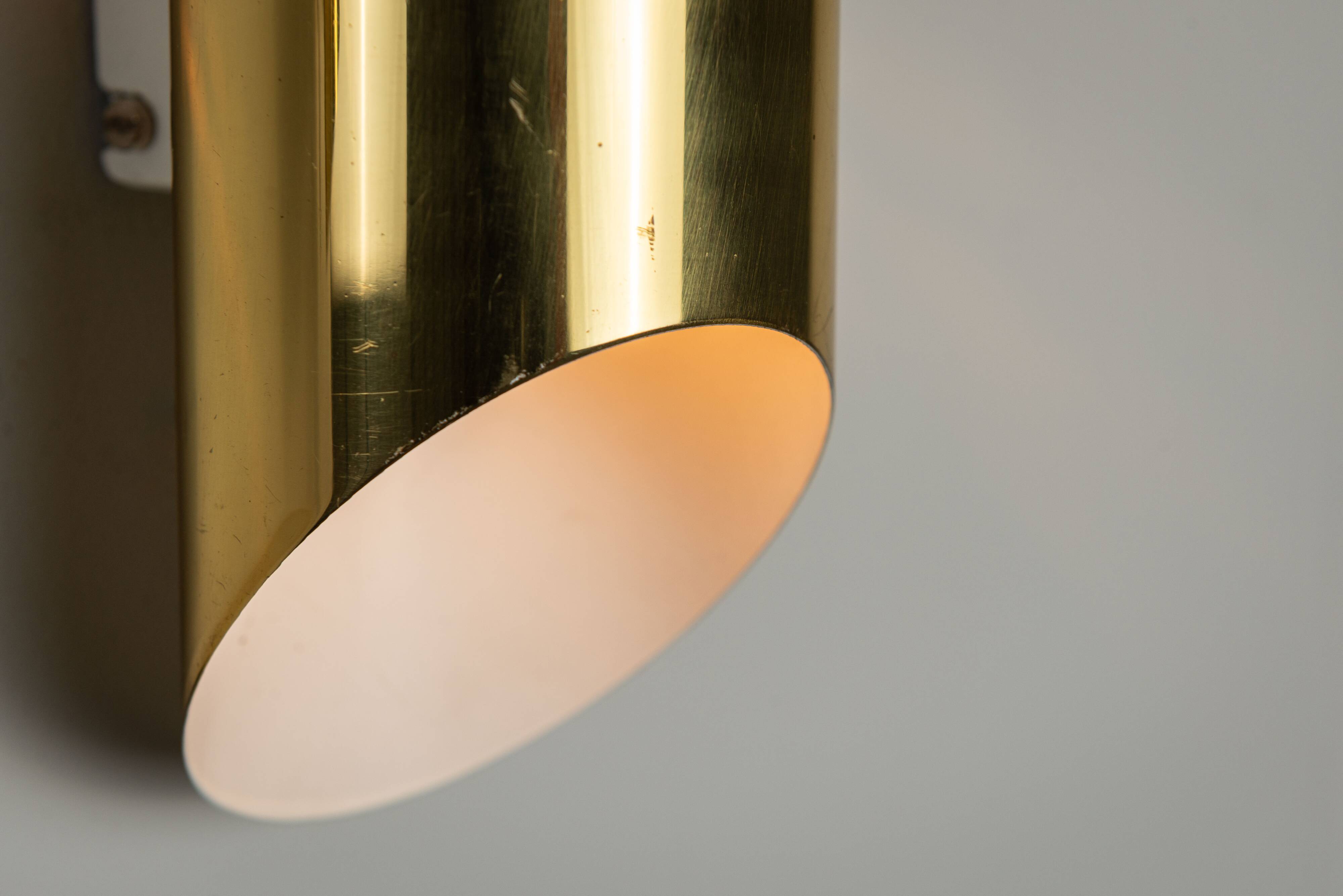 Pair of cylindrical wall lamps in brass with perforated shades