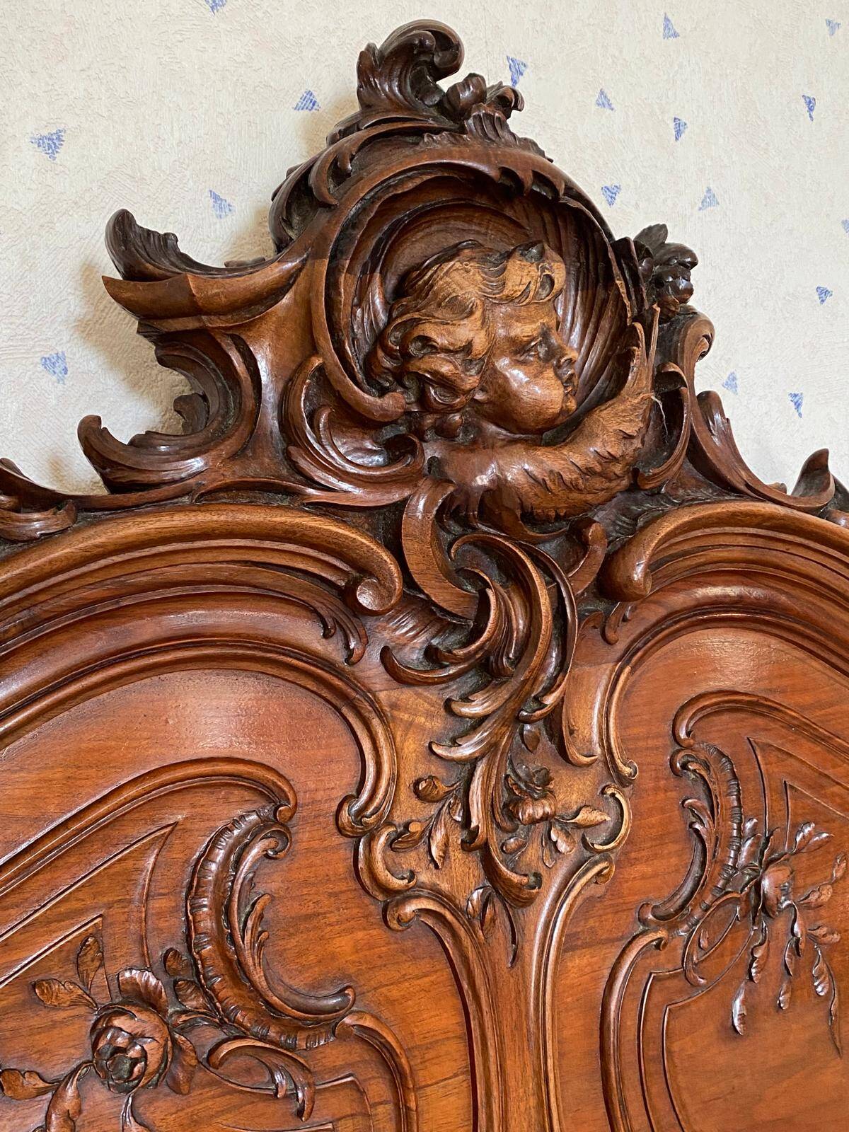 Superb Louis XV Provençal bed in richly carved and engraved walnut.