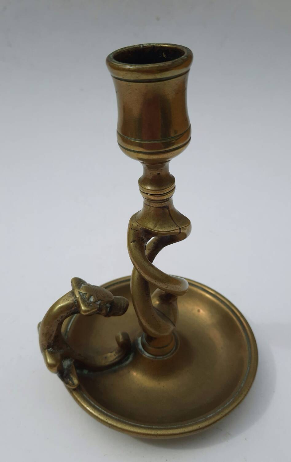 Antique bronze candlestick with dragon-shaped handle from the 17th century