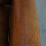 Sheep leather wingback chair with patina