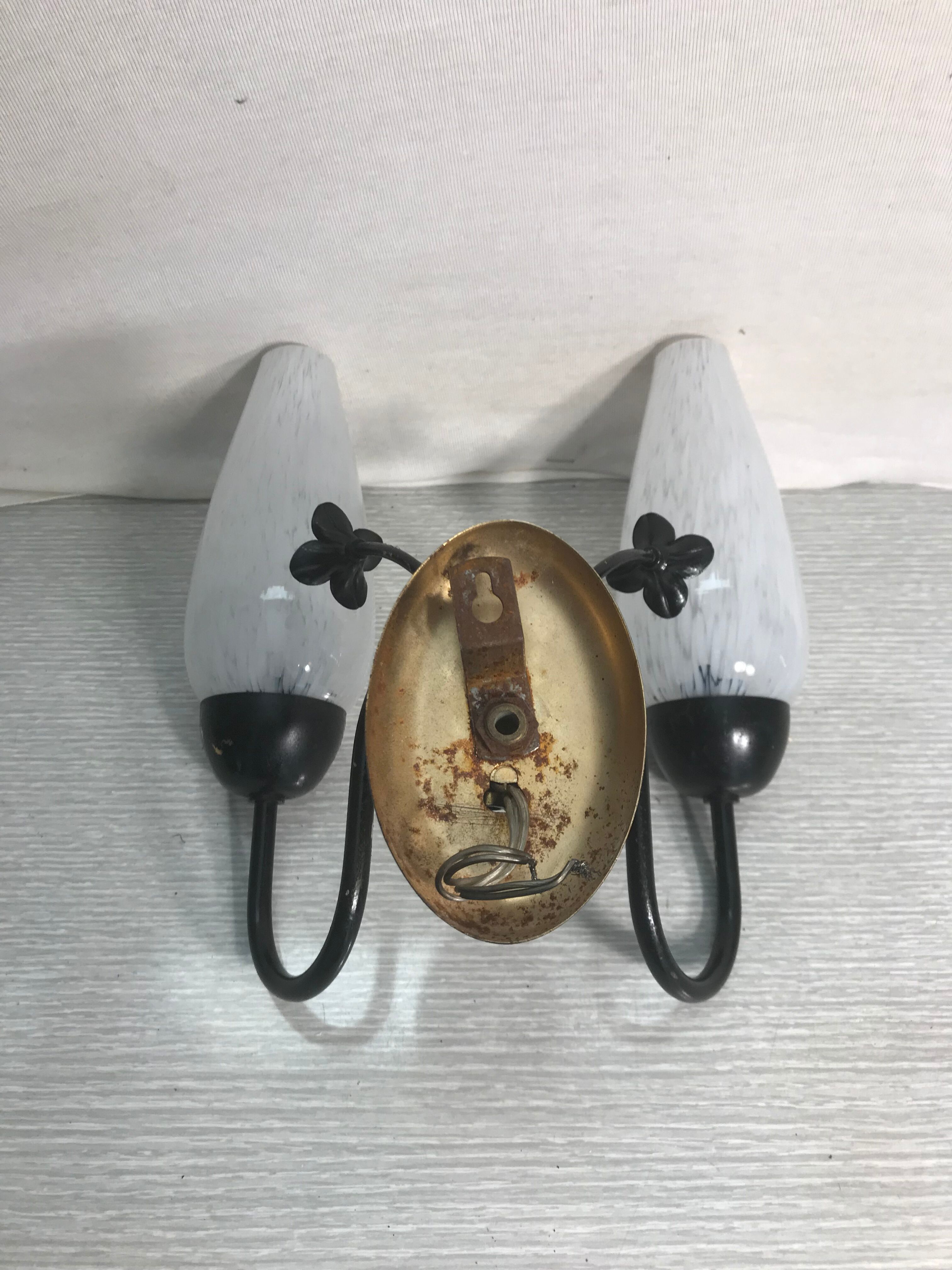 Vintage double metal black wall sconce with flowers and white glass reflectors