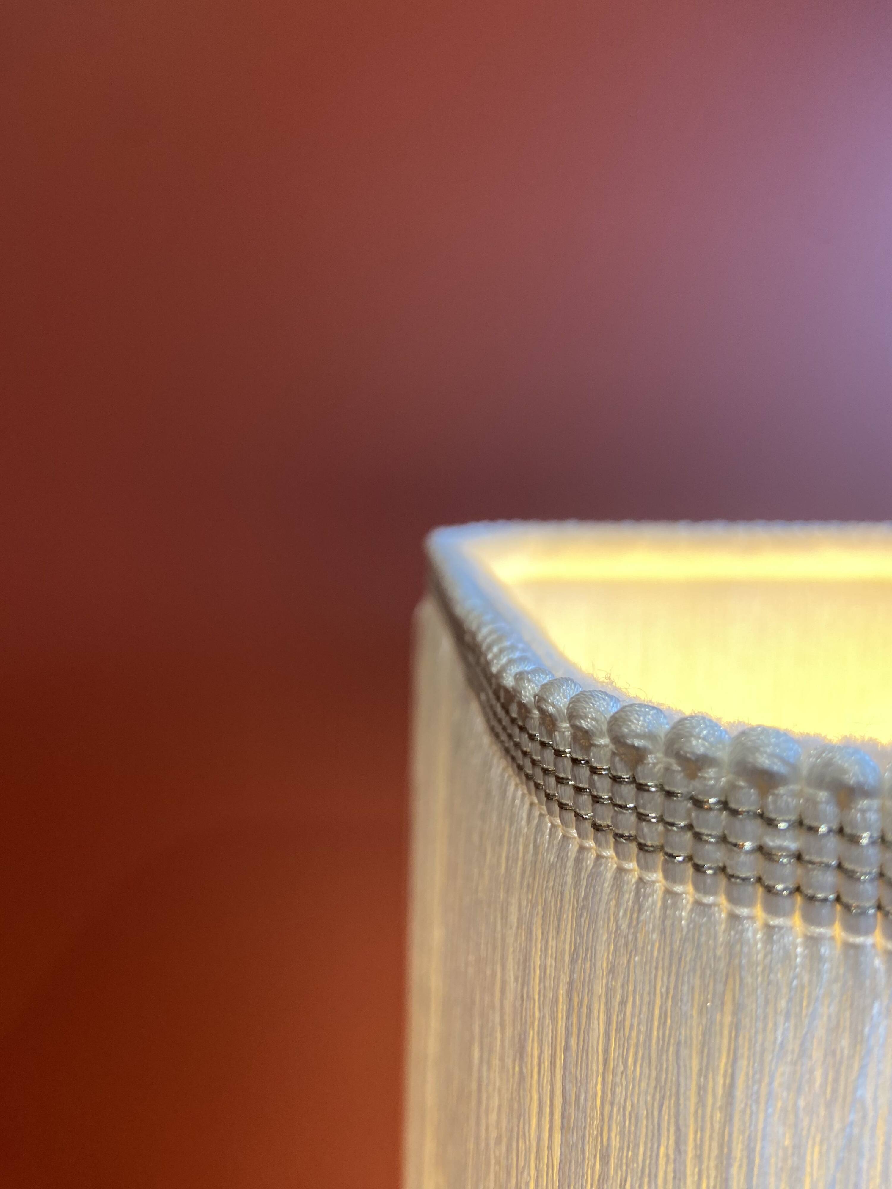 Beige marble stucco base, Houles white ecru fringed lampshade.